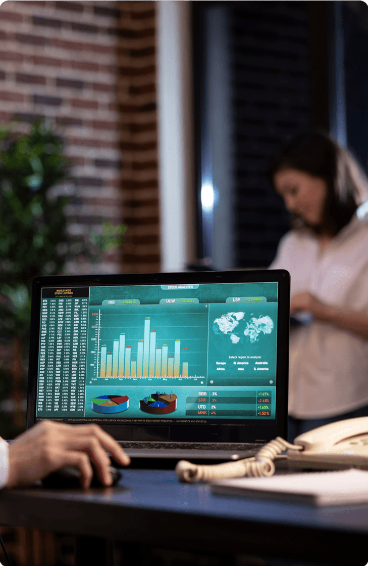 Developer reviewing a custom software application on a laptop